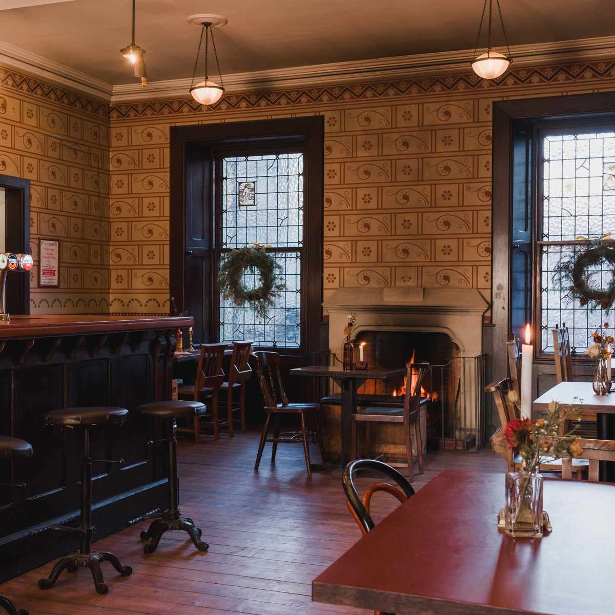 Websters Glasgow | Interior shot of the Bar & Snug with table, chair and stools